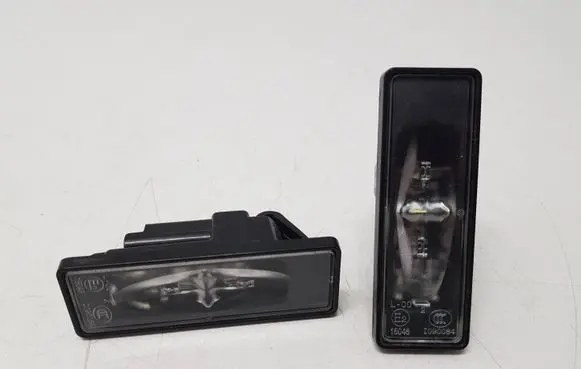 Opel Corsa F Number plate light 1090084