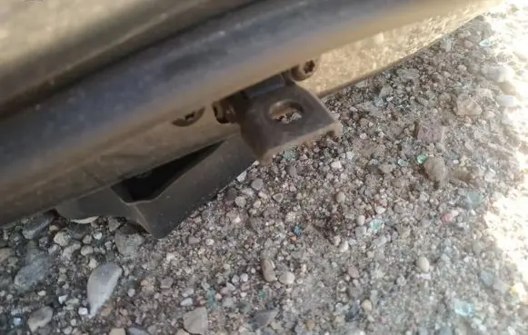 Front door check strap stopper