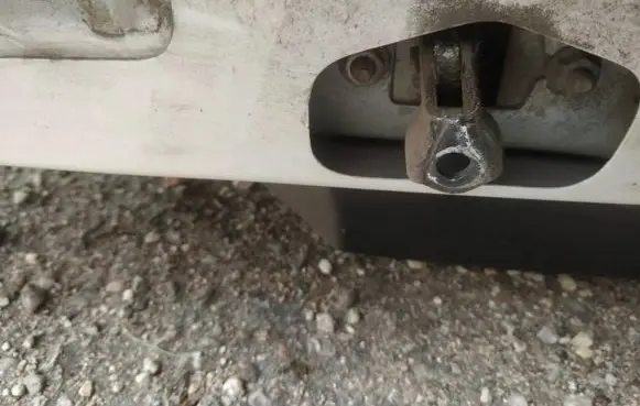 Front door check strap stopper