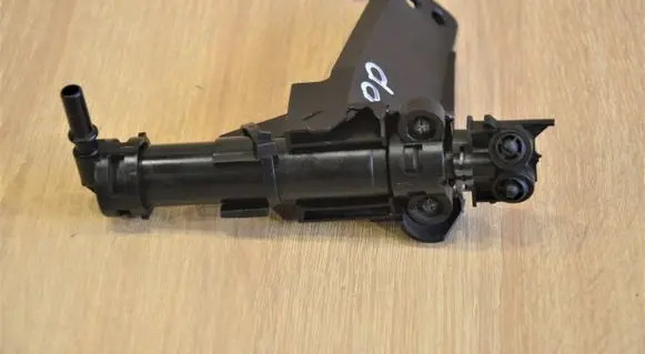 Headlight washer spray nozzle