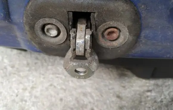 Front door check strap stopper