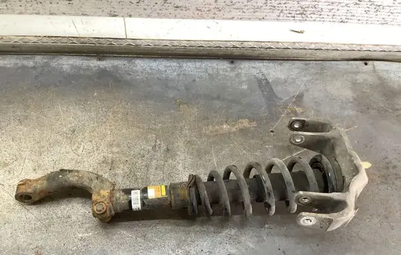 Cadillac SRX Front shock absorber with coil spring 424312 142241 22206378