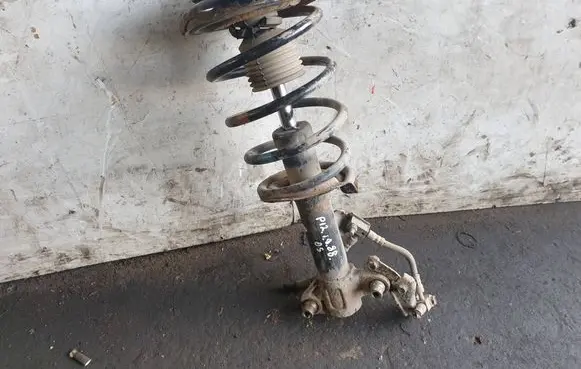 Front shock absorber with coil spring