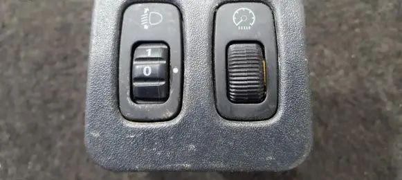 Headlight level height control switch