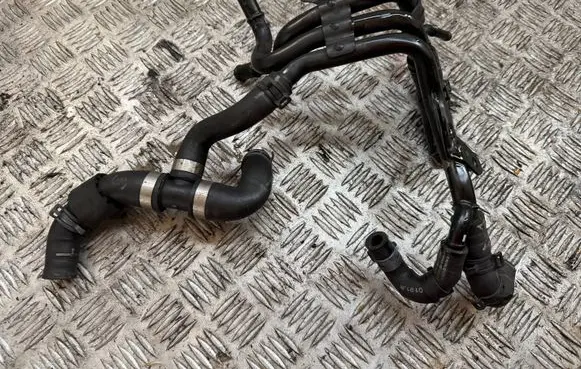 Volkswagen Golf VII Engine coolant pipe/hose 04L121058AA
