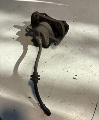 Dacia Spring Front brake caliper 