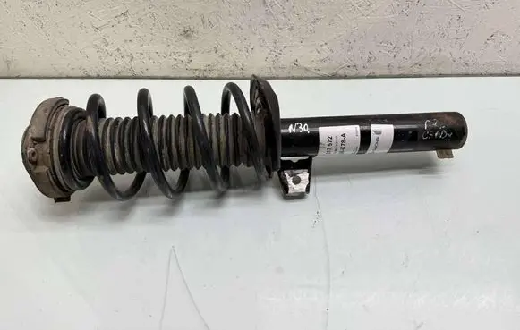 Volkswagen Caddy Front shock absorber with coil spring