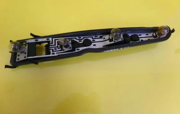 Tail light bulb cover holder