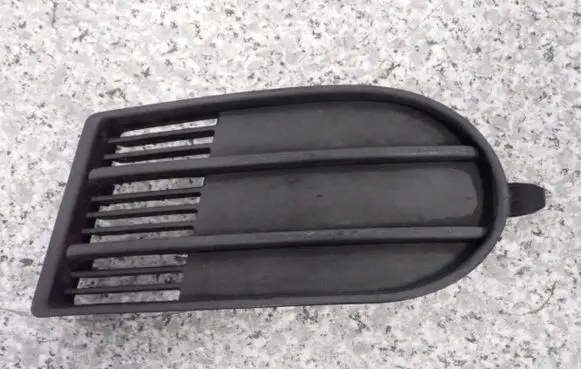 Suzuki Swift I Front fog light trim/grill 