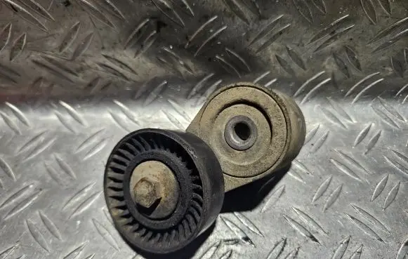 Chrysler Voyager Generator/alternator belt tensioner 04861630AB