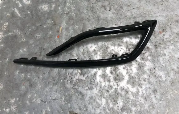 Rear bumper trim bar molding