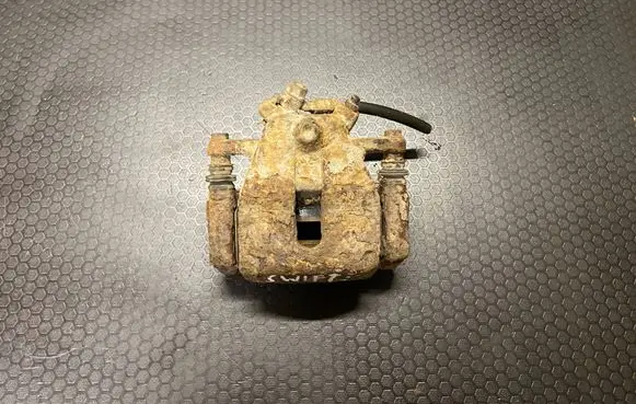 Suzuki Swift I Front brake caliper