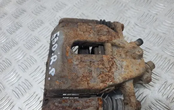 Suzuki Swift I Front brake caliper