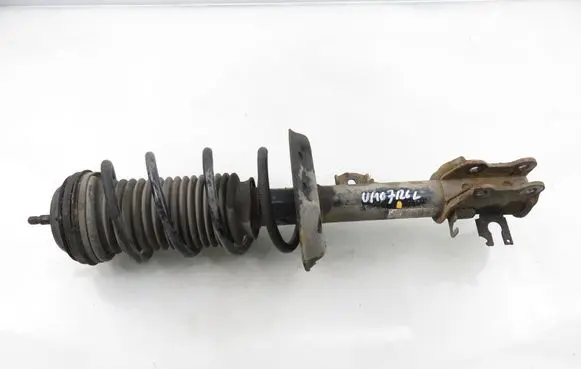 Opel Corsa D Front shock absorber with coil spring 