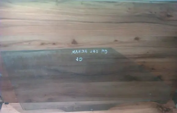 Mazda 323 Front door window glass four-door