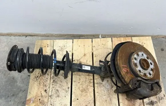 Volkswagen Golf VII Front shock absorber with coil spring 5Q0413023FJ