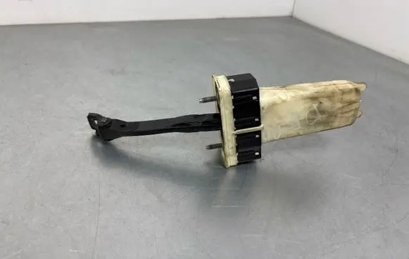Front door check strap stopper