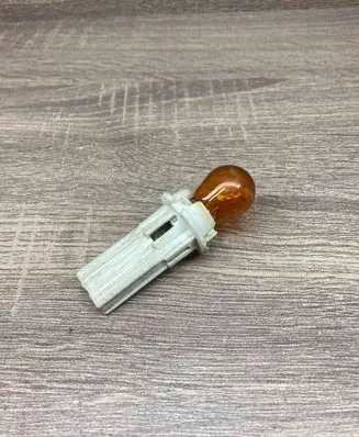 Tail light bulb cover holder
