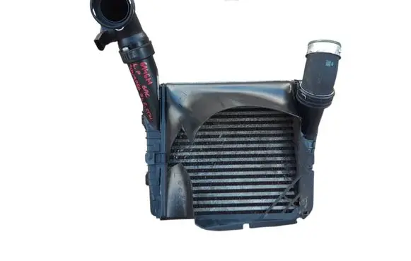 Volkswagen Touareg I Intercooler radiator 7L0117339
