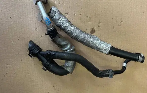 Volkswagen Arteon Engine coolant pipe/hose 06K121197AM