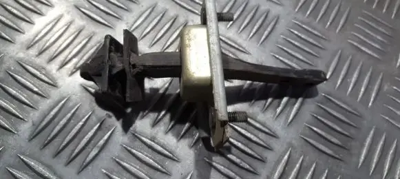 Mazda 323 F Rear door check strap stopper