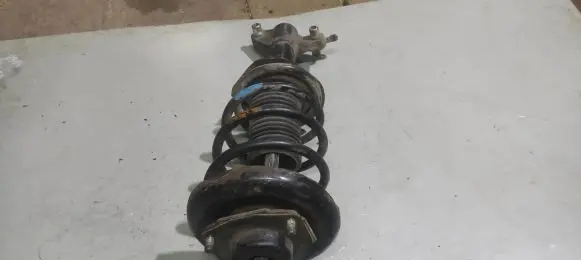 Nissan Primera Front shock absorber with coil spring