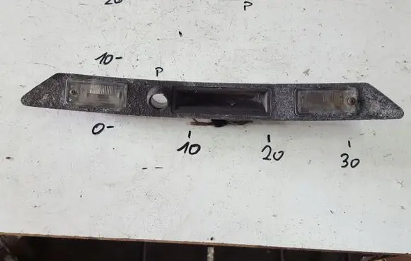 Trunk door license plate light bar