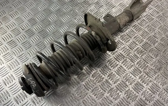 Front shock absorber with coil spring
