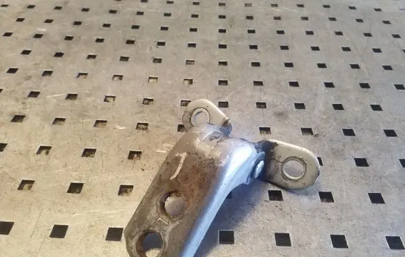 Front door lower hinge