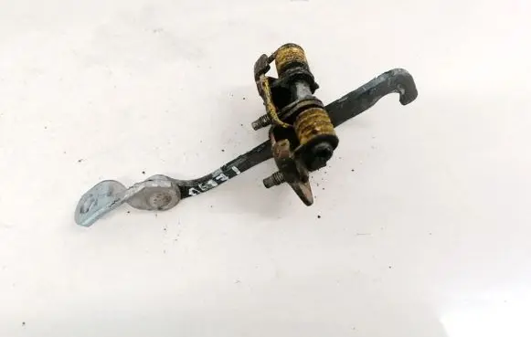 Front door check strap stopper