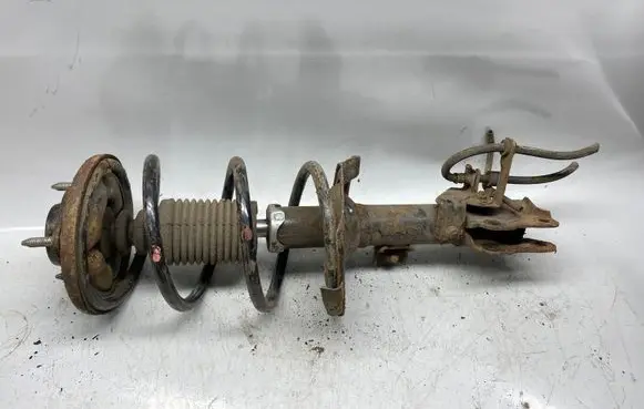 Mitsubishi Lancer X Front shock absorber with coil spring