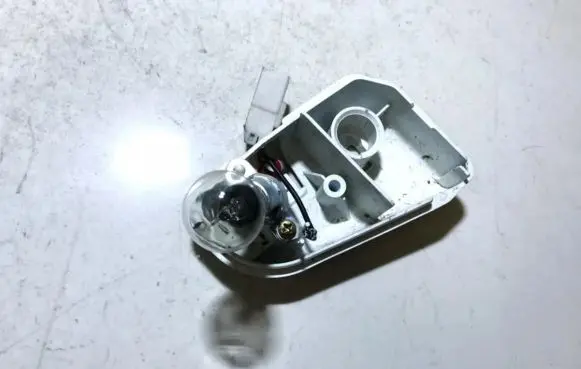 Mazda 626 Tail light bulb cover holder