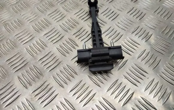 Front door check strap stopper
