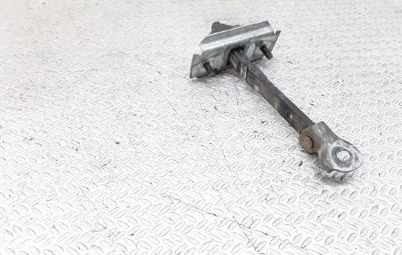 Mazda MPV Front door check strap stopper