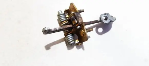 Front door check strap stopper
