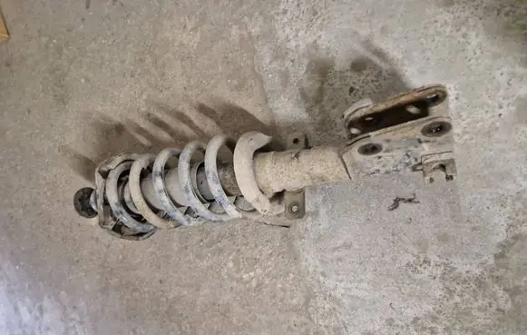 Front shock absorber with coil spring