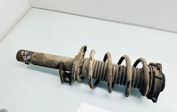Volkswagen Touran II Front shock absorber with coil spring 