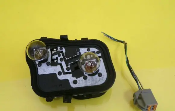 Tail light bulb cover holder