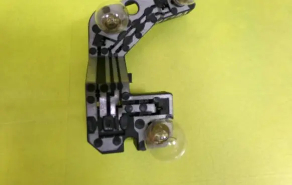 Tail light bulb cover holder