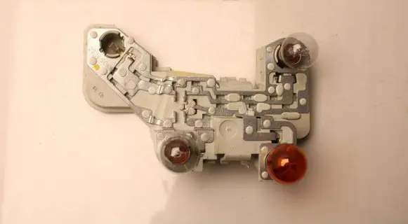 Tail light bulb cover holder