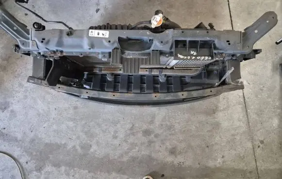Radiator support slam panel