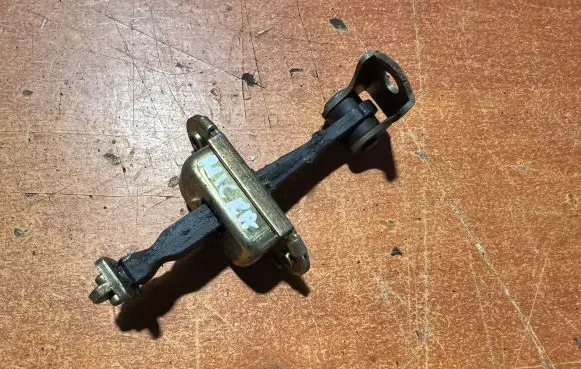 Nissan Micra Front door check strap stopper