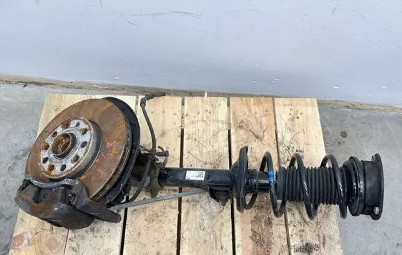 Volkswagen Golf VII Front shock absorber with coil spring 5Q0413023FJ