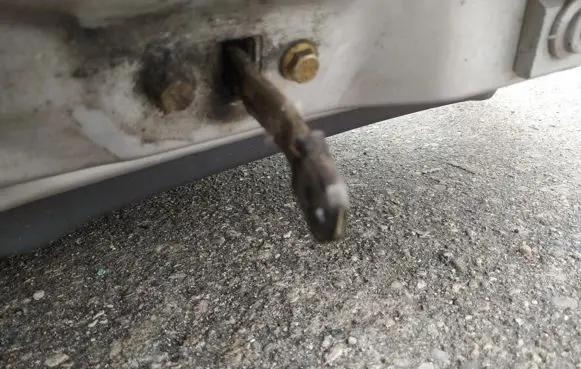 Front door check strap stopper