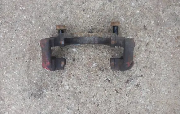 Volkswagen Touran I Front Brake Caliper Pad/Carrier 