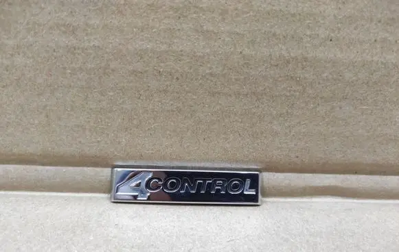 Renault Laguna III Front door emblem/model letters 990882613R