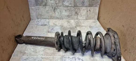 Nissan Primera Front shock absorber with coil spring