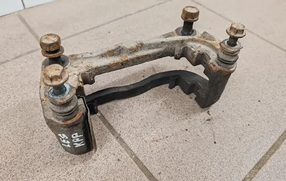 Subaru Legacy Front Brake Caliper Pad/Carrier 