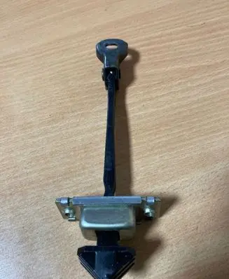 Front door check strap stopper