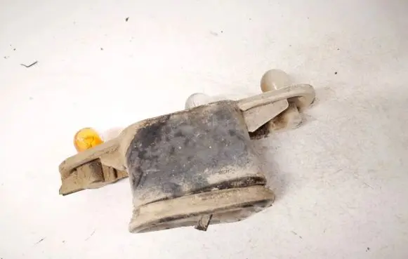 Tail light bulb cover holder